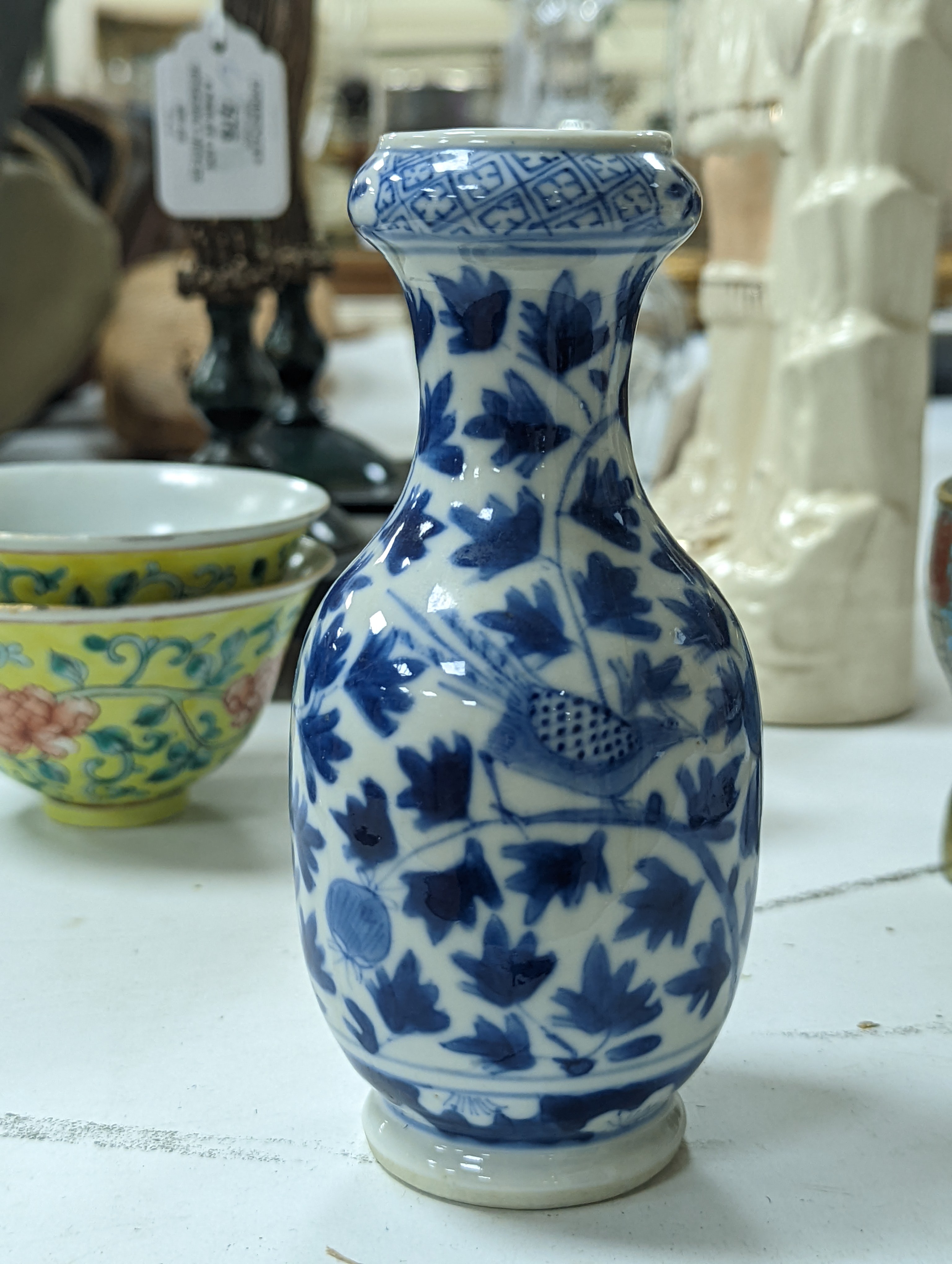A group of Chinese porcelain, 19th /20th century, to include a pair of yellow ground bowls, 10.8 cm diameter, a blue and white vase, Xuande mark, a similar bowl and vase, and a champleve enamel bronze koro and cover